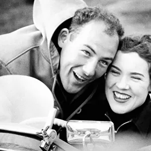 1955 Ladies handicap race. Goodwood, West Sussex, Great Britain. 26 March 1955. Stirling Moss congratulates his sister Pam after she finished in 1st position in a MG TF, portrait. World Copyright: LAT Photographic Ref: Autosport b&w print